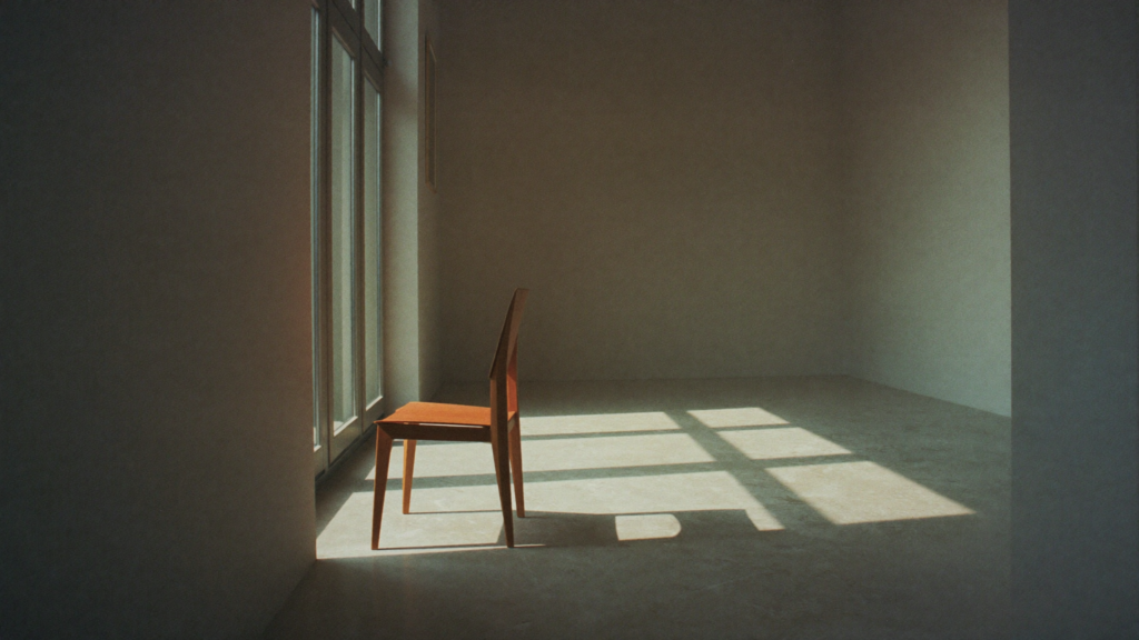 A single wooden chair beside a tall window in a calm, uncluttered room at first light, with morning sun casting an ordered grid of light across a pale stone floor.